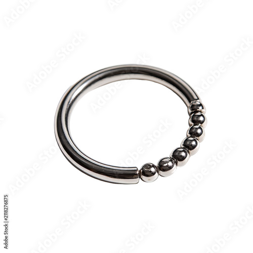 Shiny silver ring, featuring a row of spherical beads on a curved band, isolated against a black background