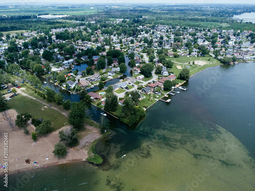 Aerial view of Zontic Beach waterfront neighborhood in Saint Zotique, Quebec, Canada on a summer day. g.