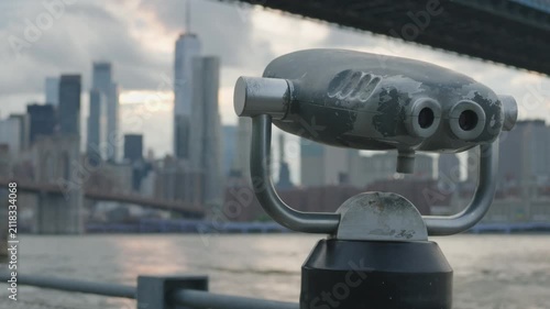 binoculars in Brooklyn Bridge Park point towards iconic view of downtown NYC