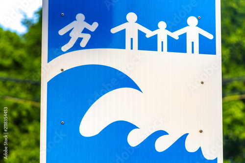 Tsunami Evacuation Route Sign Toward Temporary Shelter Tropical Thailand.