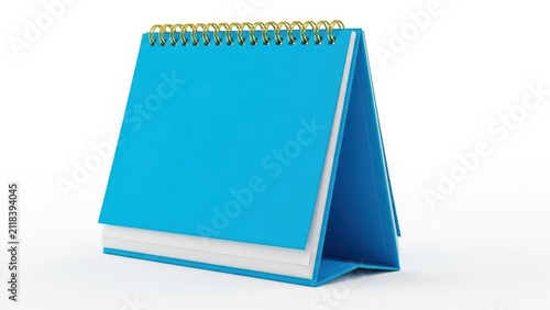 Blue spiral notebook with gold wire binding open on table