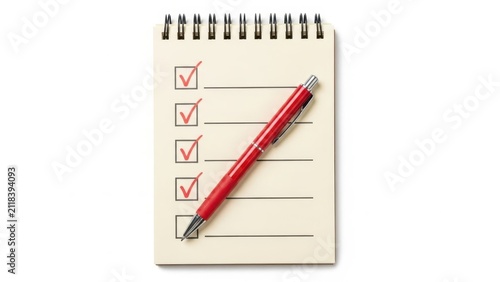 Red pen checking boxes on a to-do list in a notebook