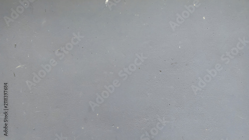 Картината върху платно A closeup shot of a smooth, flat, light grey painted wall surface with subtle te