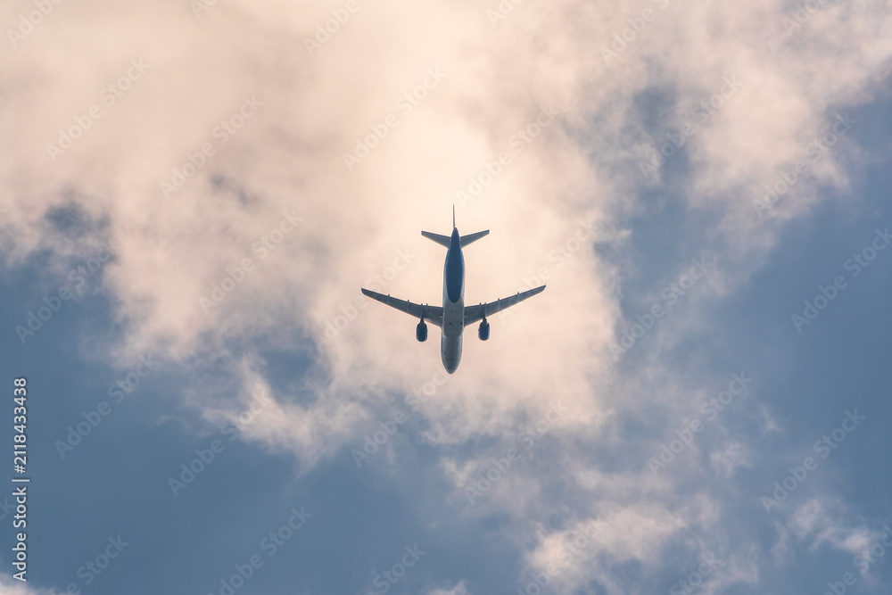 Fototapeta premium Airplane before landing in blue sky, Airbus A321