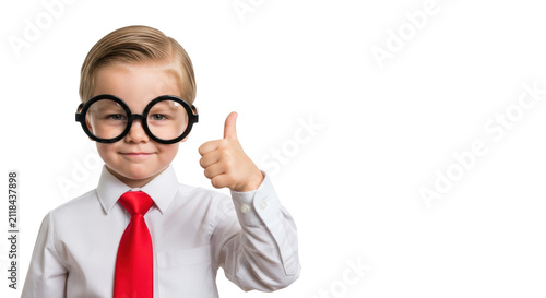 A confident caucasian preschooler (5) in a white shirt, red silk tie, and novelty black glasses, giving an enthusiastic thumbs up on a seamless high-key white background with copy space. Concept of