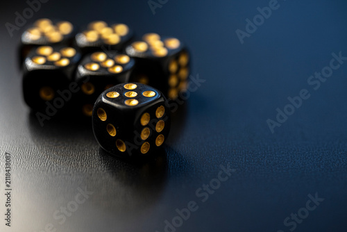Cuadro en lienzo Black dice with gold pips on dark background The Concept of luxury gaming