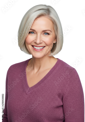 A radiant middle-aged caucasian woman with a platinum blonde bob and burgundy sweater smiling confidently, close-up headshot against a high-key gray-white background with copy space, concept of