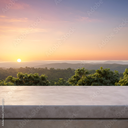 A view of a sunset, Front view of a smooth polished concrete architectural ledge against a soft gradient sunset sky