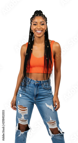 young afro american woman with box braids and a radiant smile in a vibrant orange crop top and ripped denim jeans on a transparent background with copy space. concept of modern youth fashion trends