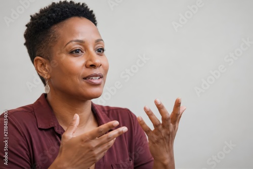 Close up woman speaking with expressive hand gestures