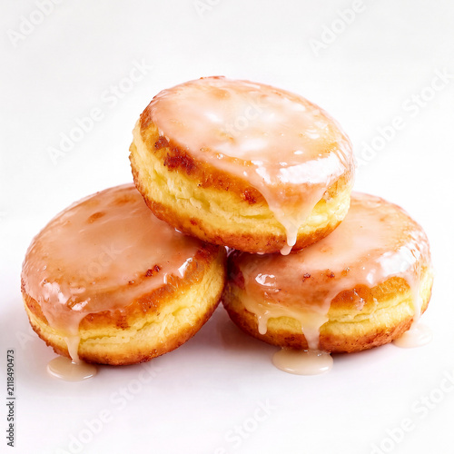 A delectable trio of freshly baked donuts, generously covered in sweet dripping glaze, piled artfully on a pristine white background, perfect for a sugary treat.