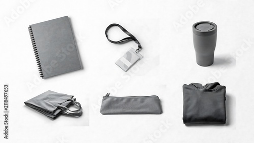 Minimal travel essentials including notebook bottle towel and accessories on white background