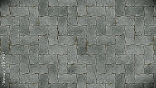 Gray interlocking paving stones form a textured seamless loop pattern background.