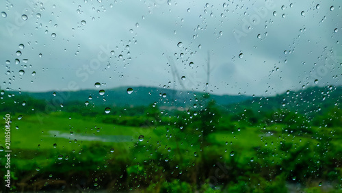 Cuadro en lienzo rain drops on a glass of the window of the car in the rainy season