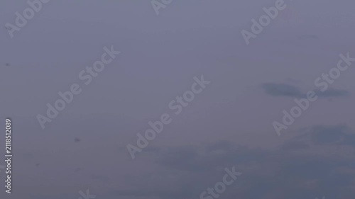 A little and timid cumulus forming in the sky at dusk