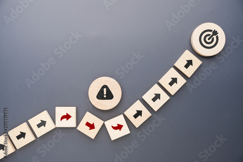 Принти на полотні Wooden arrows changing direction to avoid risks while staying on course toward a