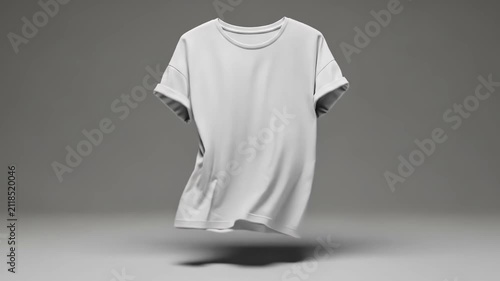 A plain white t-shirt floating against a smooth neutral grey background