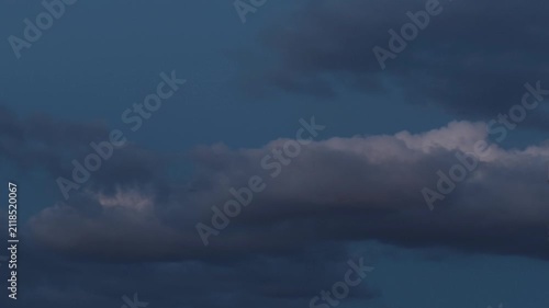 Curious cumulus clouds in the sky that is darkening