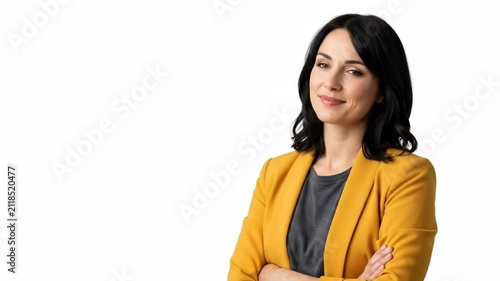 A confident woman in a mustard yellow blazer posing against white background