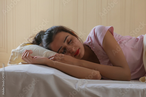 young girl sleeping tension free at home