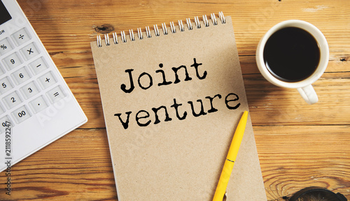 Obraz na plátně white paper with joint venture text