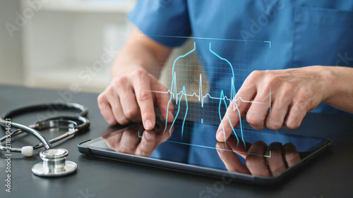 Healthcare technology and innovation a doctor's hand interacting with a digital interface displaying vital signs