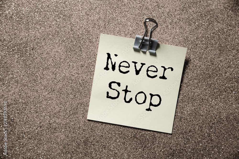 Fototapeta premium Minimalist Motivational Poster with Never Stop