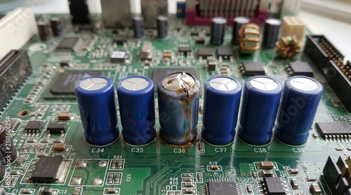 A Macro View of a Blown Electrolytic Capacitor on a Vintage Computer Motherboard