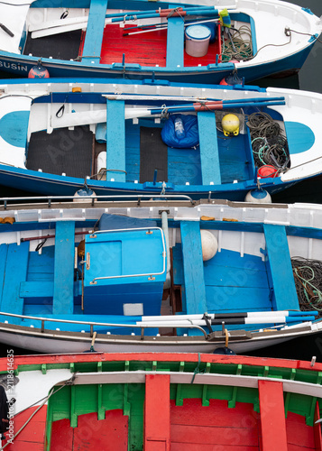 Calm maritime symmetry in traditional wooden boats moored side by side