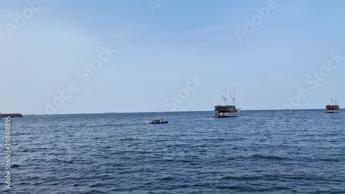 Wooden Tourist Ships Sailing on a Calm Blue Sea