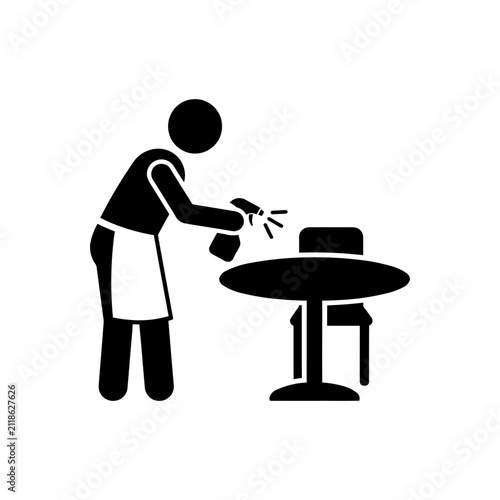 Obraz na płótnie Waiter sanitizing restaurant table icon