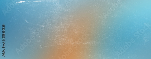 Soft blue and orange gradient background with subtle vintage texture and light dust specks, abstract atmospheric subtle backdrop for design.
