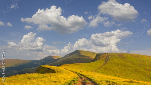 road among a mountain plateau near a slope time lapse scene