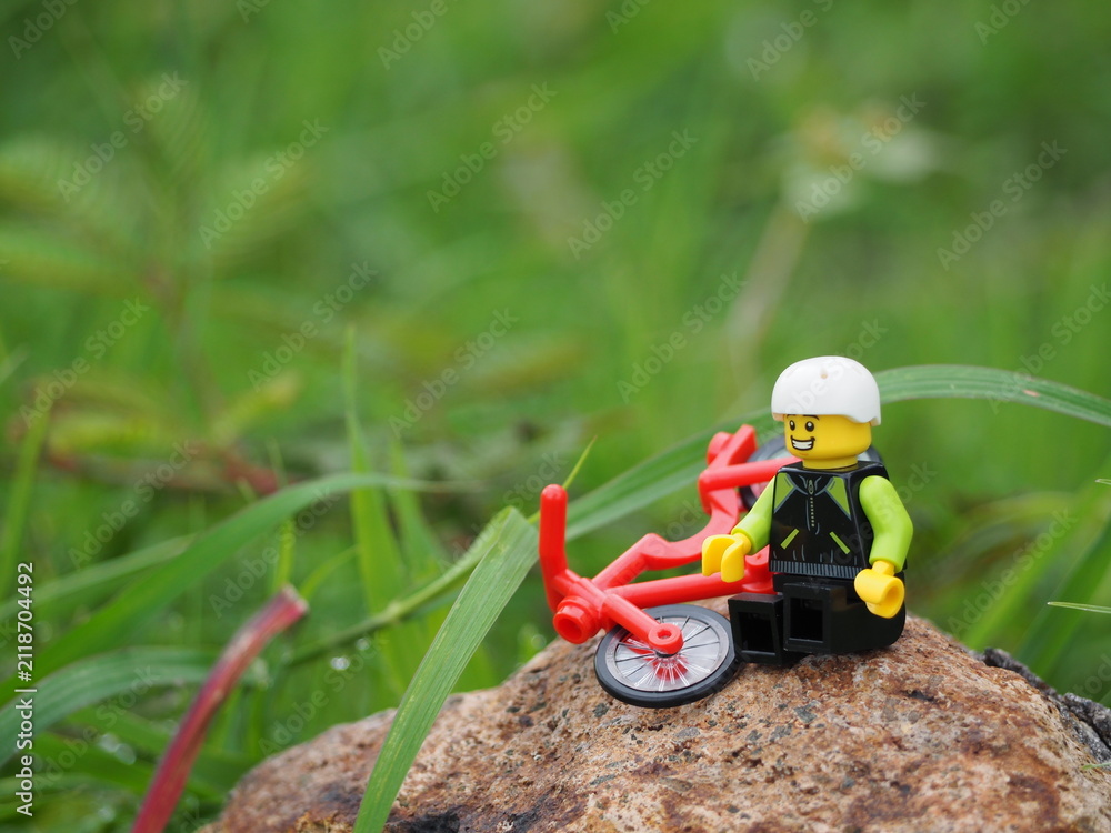 Fototapeta premium Indonesia - January 1, 2020 : Mini toy of action figure at outdoor with blurred background. Toy photography concept.