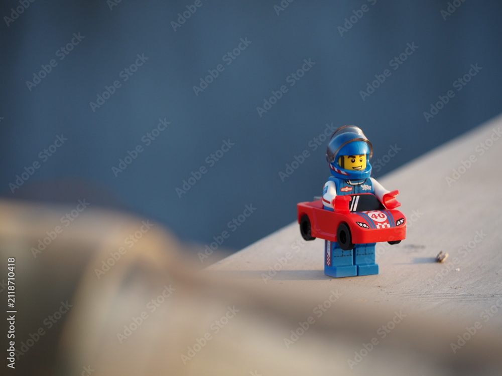 Fototapeta premium Indonesia - July 16, 2019 : Mini toy at outdoor with blurred background. Toy photography design concept.