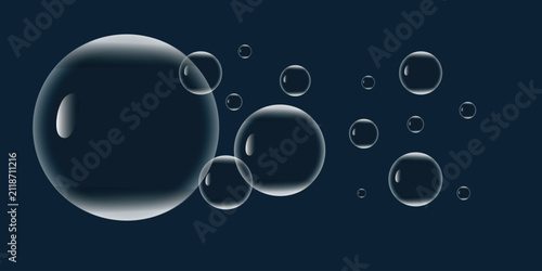 Obraz na plátně Transparent soap bubbles floating on a dark blue background creating a clean and