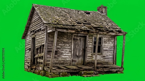 Old abandoned wooden cabin with weathered planks and green background, rustic and eerie