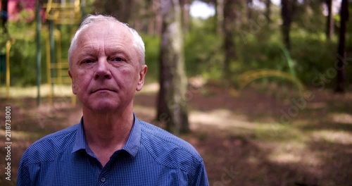 Close-up of the face of a happy, friendly older european man.