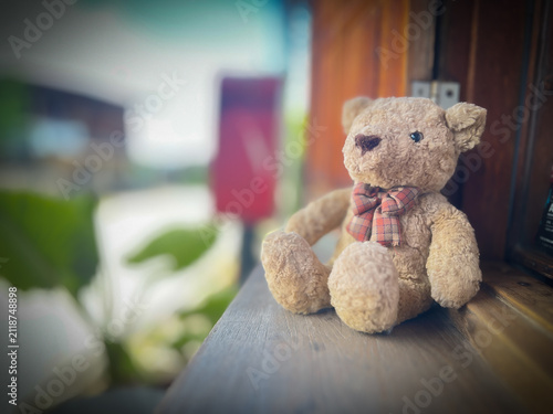 lonely teddy bear sleep on cement floor for created postcard of international missing children, broken heart, lonely, sad, alone unwanted cute doll lost.