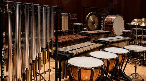 Polished concert chimes and orchestral percussion instruments create stunning visual display concert hall, showcasing musical craftsmanship
