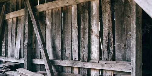Quadro su tela Weathered grey wood planks of an old barn wall