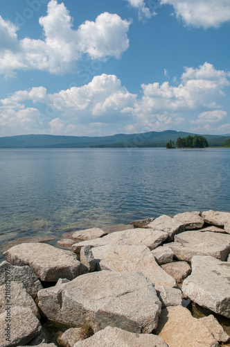Rocky shoreline of lake Turgoyak in summer, South Ural, Russian Federation