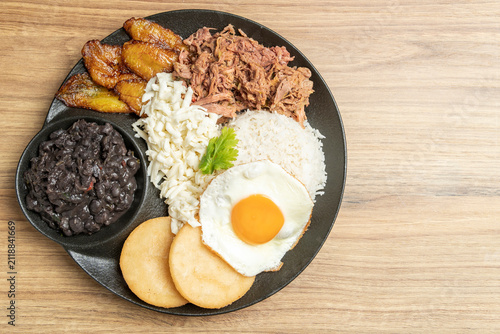 Venezuelan pabellón criollo plate with shredded beef and plantains