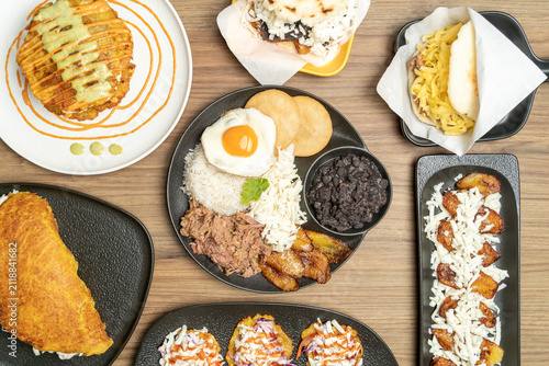 Venezuelan food spread with pabellon criollo and various dishes