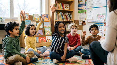 Diverse children raising hands in classroom. Elementary students participating in school lesson.