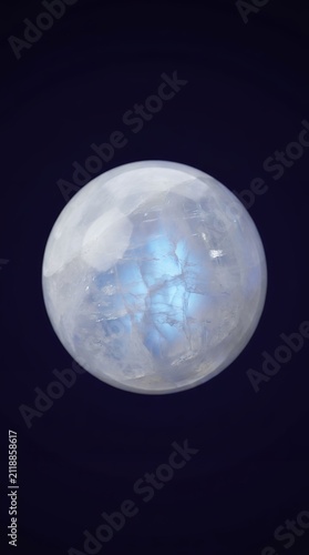 Mystical glowing crystal ball luminous blue orb spiritual light fantasy background deep glow