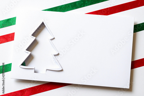 Minimalist Festive White Cardboard Christmas Tree Cutout with Red Star Design