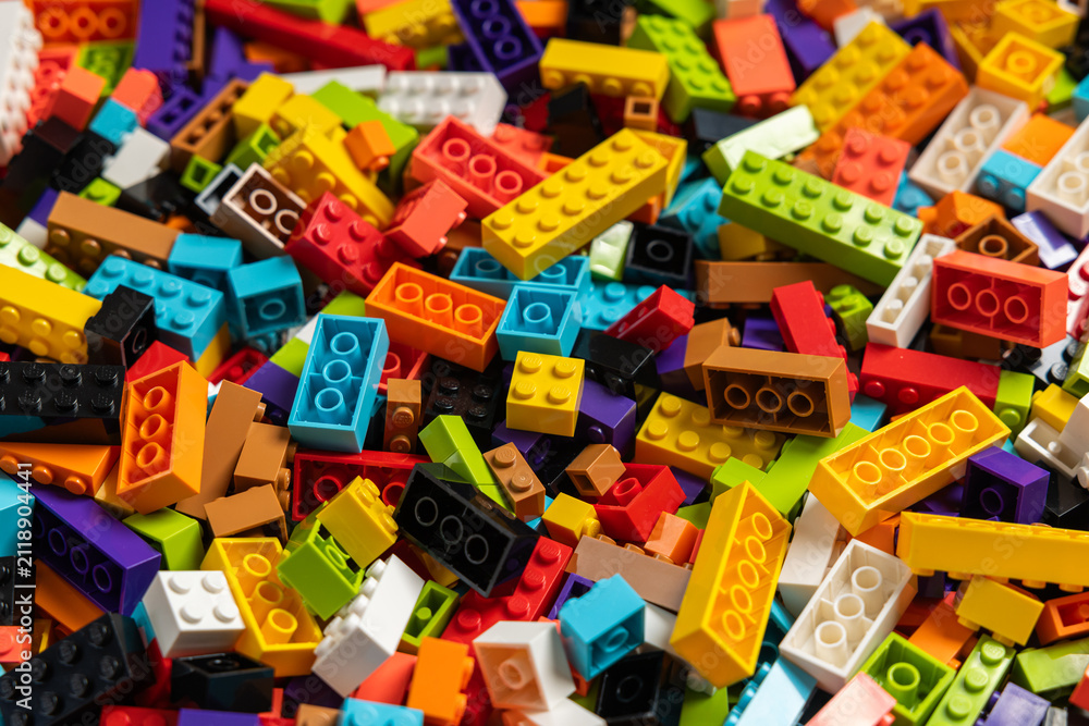 Fototapeta premium Colorful mix of plastic Lego building blocks and bricks background
