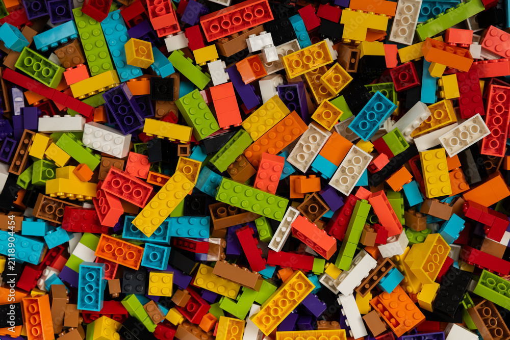 Fototapeta premium Colorful mix of plastic Lego building blocks and bricks background