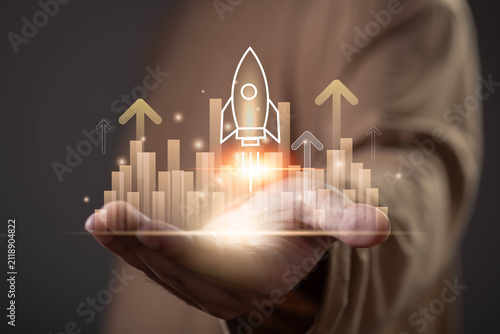 Obraz na plátne Business growth and startup success concept with rocket launch above financial chart